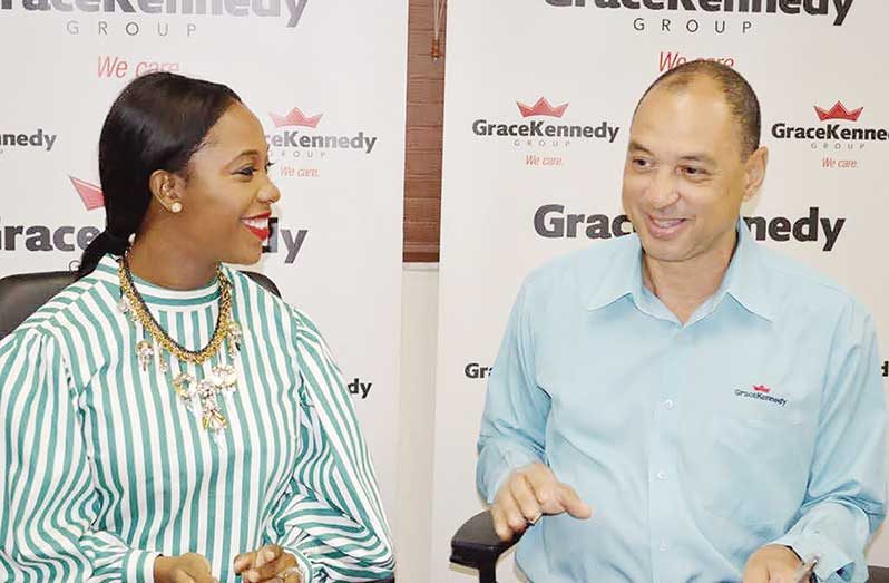 Shelly-Ann Fraser-Pryce with outgoing GraceKennedy CEO Don Wehby