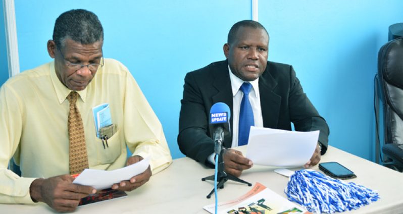 At right Pastor Wendell Jeffrey makes his declaration. At left is Pastor Ronald Mc Garrel, Chairman of the Inter-Religious Organisation. (IRO).