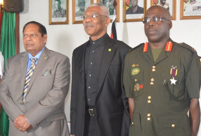 New Chief of Staff of the GDF, Brigadier Patrick West (right) flanked by President David Granger (center) and Prime Minister Moses Nagamootoo following the swearing in ceremony. [Navendra Seoraj photo]