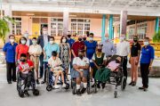 Officials from Stena Carron Drilling and Falcon Logistics along with staff and children of Ptolemy Reid Rehabilitation Centre