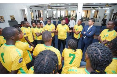 President Irfaan Ali (seated centre) and government officials with Golden Jaguars players and management