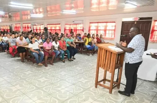 Minister within the Office of the Prime Minister with responsibility for Public Affairs, Kwame McCoy addresses pathway workers at Kuru Kuru Training College