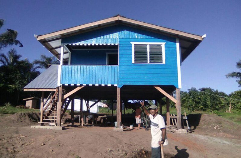 A White Water resident outside one of the completed homes