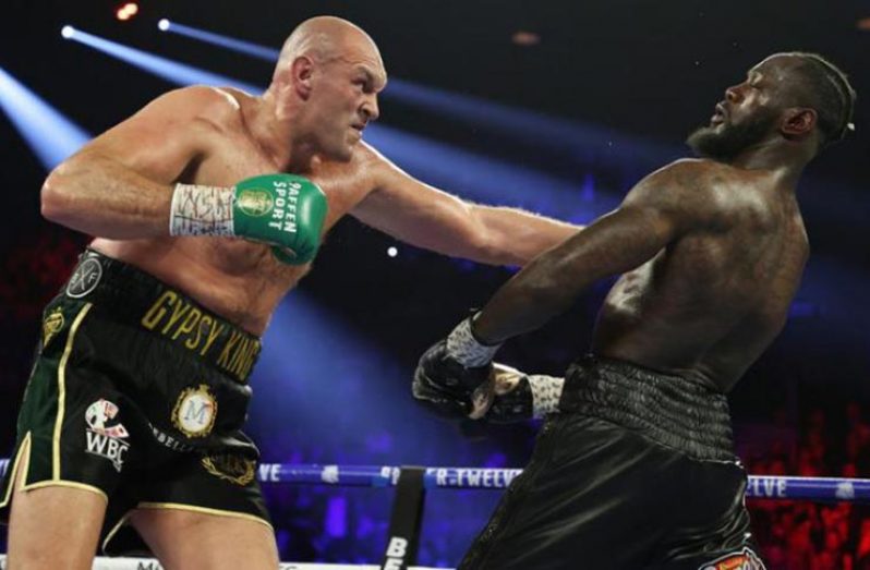 Tyson Fury (left) stopped the previouslyundefeated Deontay Wilder to claim the WBC title in February (Al Bello/Getty Images)