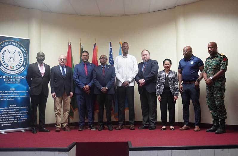 Dr. Randolph Persaud, Director of the National Defence Institute (third from left) with other officials at the training