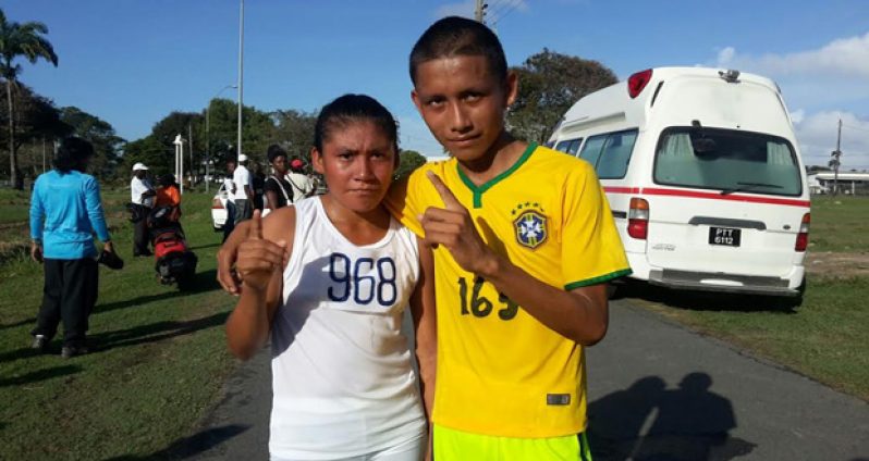 Beverley Ignacio of Rupununi (left) along with Reckey Williams of North West pose after winning the 10k event