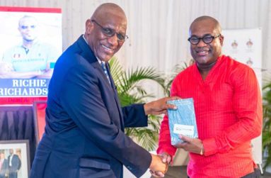 Governor General of Antigua & Barbuda, Sir Rodney Williams (left), receives a copy of the book, ‘Richie Richardson: The Man and the Legacy’, from its author, Professor Densil Williams