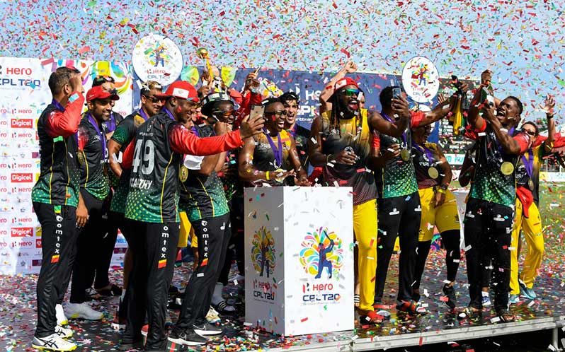 Saint Kitts & Nevis Patriots players celebrate with the trophy after winning the 2021 Hero Caribbean Premier League Final match 33 between Saint Lucia Kings and Saint Kitts & Nevis Patriots at Warner Park Sporting Complex on September 15, 2021 in Basseterre, Saint Kitts and Nevis. (Photo by Randy Brooks - CPL T20/Getty Images)