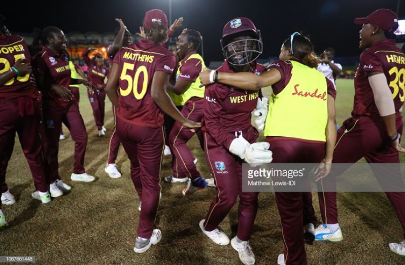 West Indies players celebrate one of their four victories during the preliminary round.