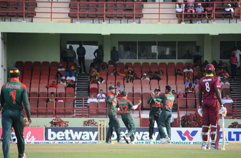 Bangladesh Celebrate one of their wickets In their 48 run drubbing of the West Indies yesterday at the Guyana National Stadium, Providence.