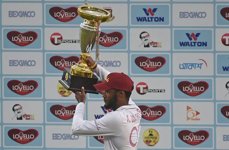 West Indies captain Kraigg Brathwaite proudly hoists the series-winning trophy after the Caribbean side’s four-wicket win over Bangladesh in the second Test match in Dhaka, Bangladesh. The visitors sealed a thrilling two-match Test series to win 2-0. (Courtesy CWI)