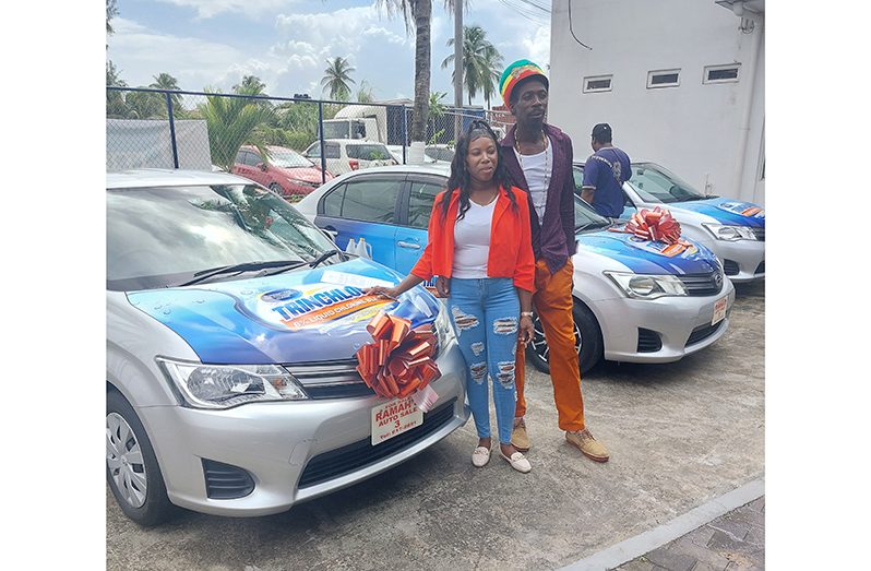 Keri Boncher and her husband with their new car