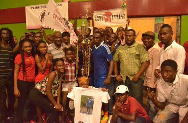 Sparta is Boss! Sparta Boss beat Back Circle 4-2 to clinch the 2017 Petra/GT beer Fustal Trophy, which Devon Millington collects from Namilco Finance controller Fitzroy McLeod