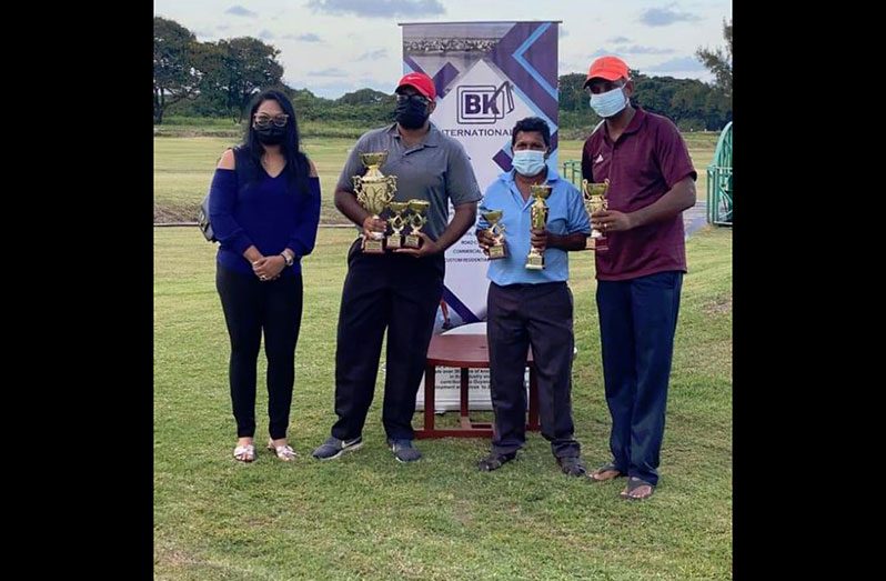 Videsh Persaud, (second from left), Mike Mangal (third from left) and Maxim Mangra (right) with their spoils.