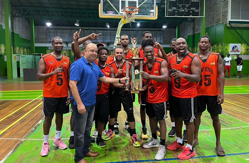 President of the Guyana Amateur Basketball Federation (GABF), Michael Singh, presenting the winner’s trophy to Ravens following their victory over Kobras in the finals of the Andrew Ifill Memorial tournament.