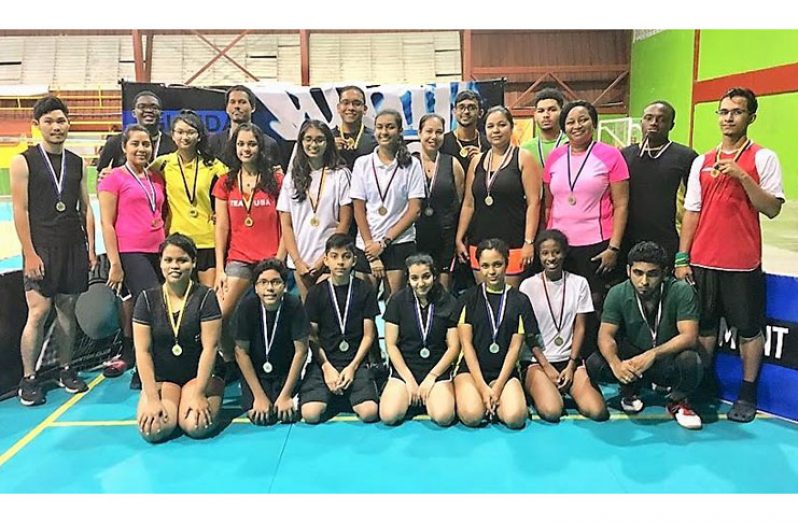 The winners pose for a photo on Friday night at the National Gymnasium.