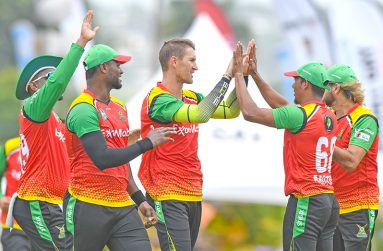 Dwaine Pretorius (C), Romario Shepherd (2L) and Gudakesh Motie (2R) of the Guyana Amazon Warriors celebrate the dismissal of Andre Fletcher of Saint Kitts & Nevis Patriots during the Men's 2023 Republic Bank Caribbean Premier League match 15 between Guyana Amazon Warriors and Saint Kitts and Nevis Patriots at Kensington Oval on September 2, 2023 in Bridgetown, Barbados