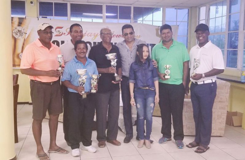 the respective winners pose with the representatives of Sanjay’s Jewellery and LGC President. (From left): Asrodeen Shaw, President Aleem Hussain, Mike Mangal, Maurice Solomon, Mr Sanjay Persaud, Ms Pavita Ramkissoon, Richard Haniff and Brian Hackett