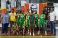 Kwakwani Secondary Boys’ U-18 Title winners with officials and Trophy.