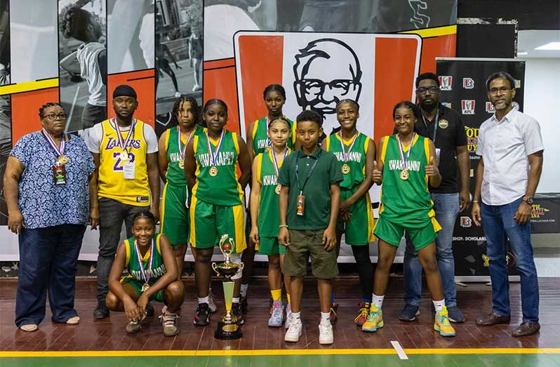 Kwakwani Secondary Boys’ U-18 Title winners with officials and Trophy.