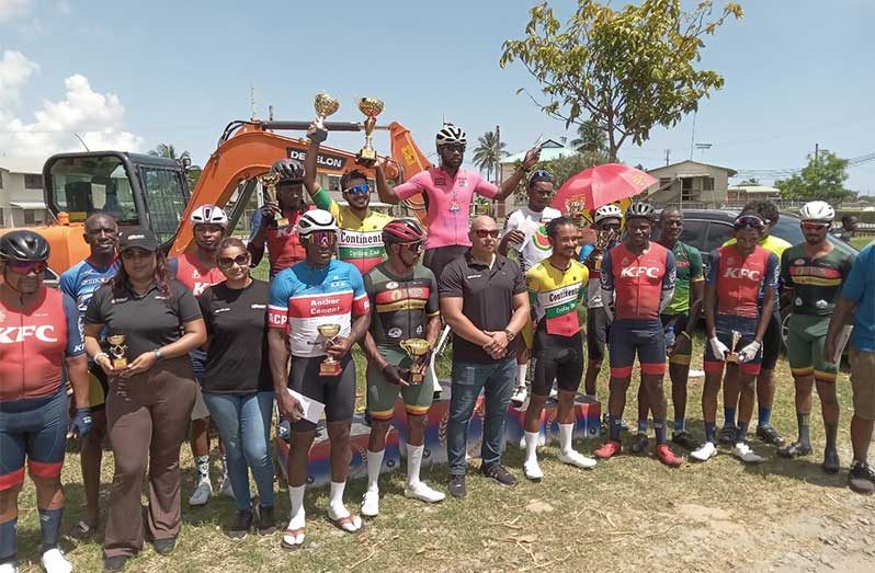 Winners of Farmsup Circuit Race; at centre in pink is open winner Jamal John