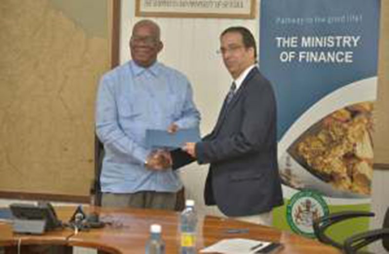 Minister of Finance Winston Jordan and World Bank Senior Country Director Pierre Nadji, at the signing of the agreement (DPI photo)