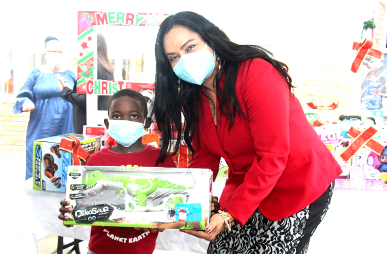 Minister Vindhya Persaud with a young boy during last year’s Wish Upon a Star