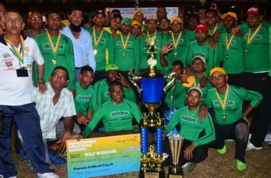 GFSCA president Ramchand Ragbeer (extreme left) poses with the victorious Wolf Warriors after they collected their cheque for $800 000 and the winners’ trophy. (Photos by Adrian Narine)