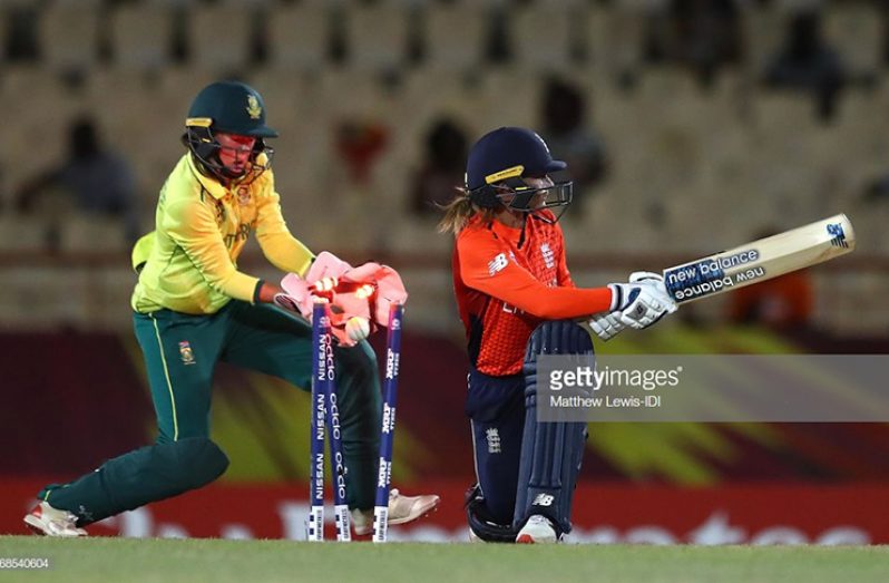 Danielle Wyatt of England
is bowled by Dane van
Niekerk of South Africa,
as Faye Tunnicliffe of
South Africa looks on
during the ICC Women's
World T20 2018 match between
England and South
Africa at Darren Sammy
Cricket Ground on November
16, 2018 in Gros
Islet, Saint Lucia. (Photo
by Matthew Lewis-IDI/IDI
via Getty Images)