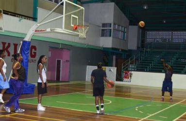 Guyana’s female team practise yesterday at the Cliff Anderson Sports Hall. (Adrian Narine photo)