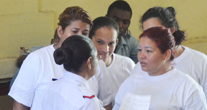 The Venezuelan female nationals speaking with their interpreter