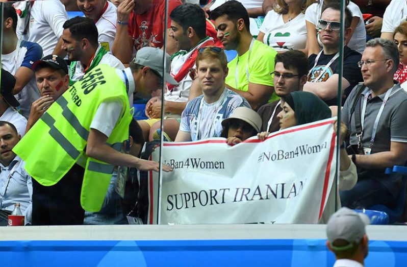 General view as a steward talks to fans displaying a banner referencing Iranian women during the match vs Morocco at Saint Petersburg Stadium, Russia - June 15, 2018.  (REUTERS/Dylan Martinez/File photo)