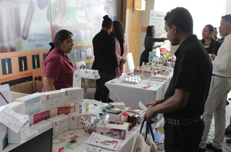 Medical Professionals view some of the services and products available at the Woodlands Hospital (Vishani Ragobeer photo)