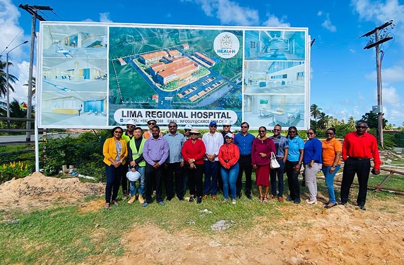 Minister of Health, Dr Frank Anthony and Minister within the Ministry of Local Government, Anand Persaud with key stakeholders. In the background is an artist’s impression of what the new hospital is expected to look like