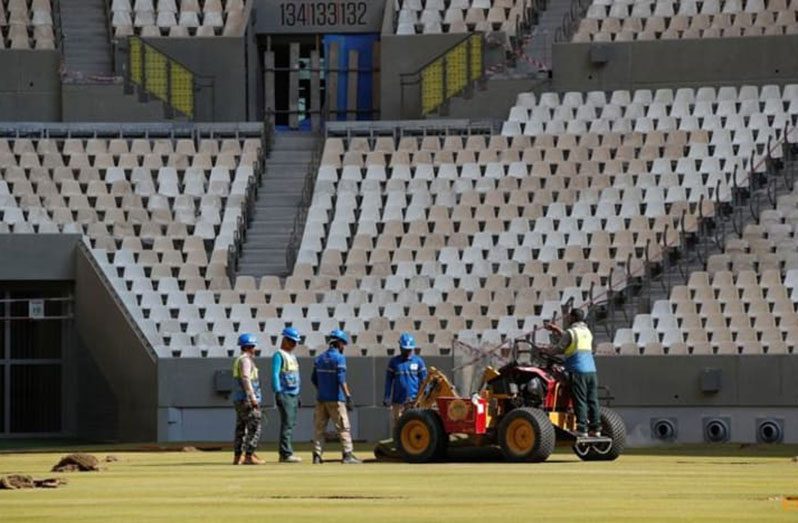 Workers lay turf inside the Lusail Stadium, the venue for the 2022 Qatar World Cup final, yesterday (REUTERS/Hamad I Mohammed)
