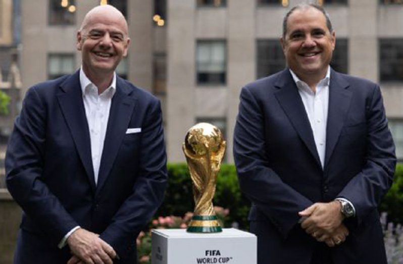 FIFA President Gianni Infantino (L) and CONCACAF President Victor Montagliani (R) pose with the FIFA World Cup trophy during an event in New York on June 16, 2022. YUKI IWAMURA/AFP via Getty Images.