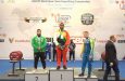 Powerlifter Carlos Petterson-Griffith on the top step of the podium