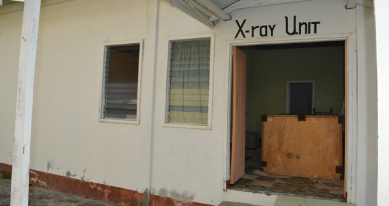 The new X-ray machine bought several years ago is still at the entrance of the decade-old building that was constructed but never used.