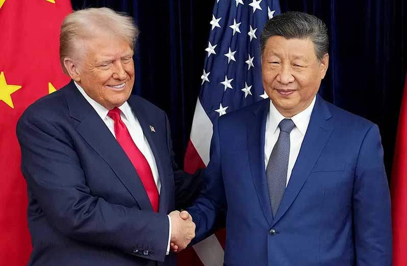 U.S. President Donald Trump and Chinese President Xi Jinping shake hands ahead of a bilateral meeting at Gimhae Air Base on October 30, 2025, in Busan, South Korea. (Andrew Harnik/Getty Images)