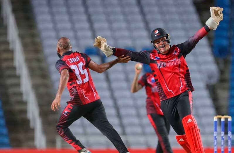 Yannic Cariah (left) took a hat-trick against the Jamaica Scorpions to bowl T&T to victory