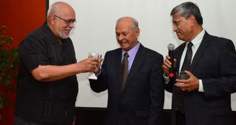 (1)	President Donald Ramotar and Dr. Yesu Persaud toast each other at Friday’s function in the latter’s honour, as new Chairman of the Demerara Distillers Limited (DDL), Mr Komal Samaroo looks on