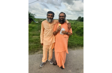 Swami Purnatmananda Giri alongside fellow Swami Sahajananda during a recent visit to Guyana