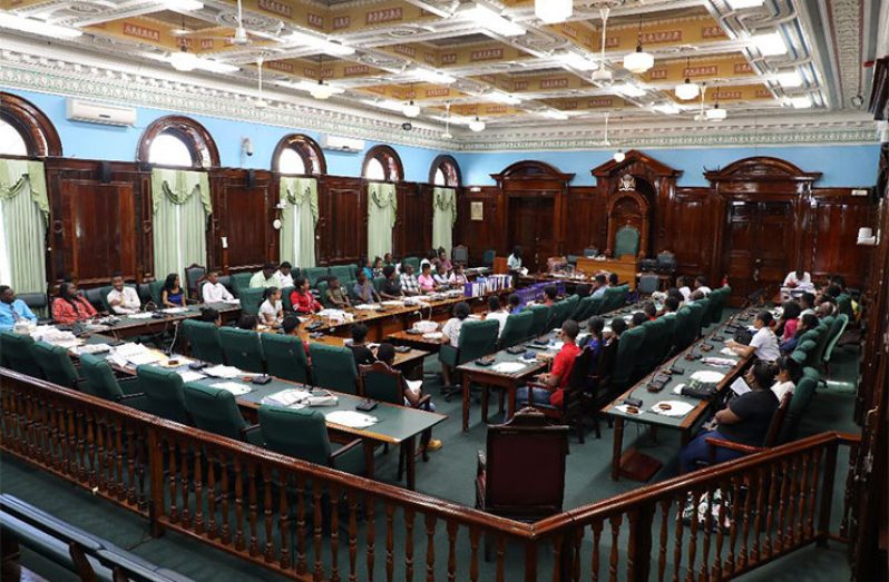 The secondary school participants of youth parliament assembled in the chambers waiting to be briefed