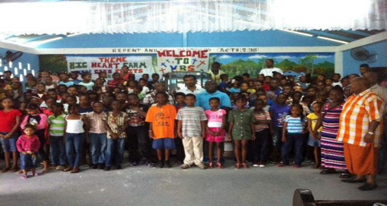 Commander Stephen Mansell and other volunteers with some of the youths at the end of the VBS programme