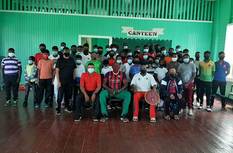 The fifty youths at the BCB mini cricket academy pose with their coaches.