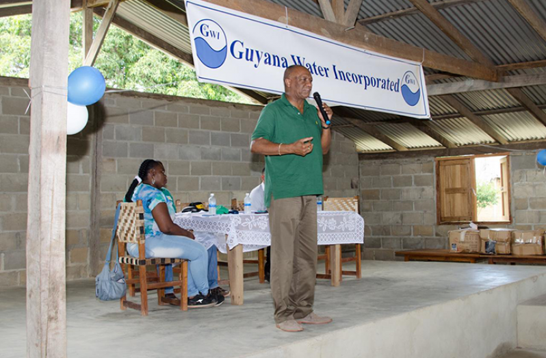 Director General of the Ministry of the Presidency, Joseph Harmon addressing residents of Yupukari, Central Rupununi during a community meeting