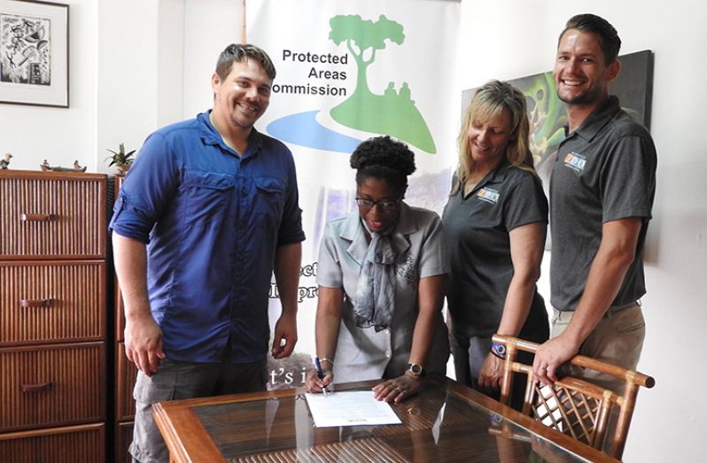 Members of the Jacksonville Zoo and Gardens (JZG) look on as the MoU for  transformation of the Guyana Zoological Park into a Wildlife Education and Rehabilitation Centre is  signed