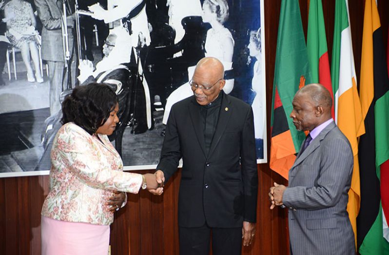 Newly-accredited Non-Resident High Commissioner of the Republic of Zambia to the Cooperative Republic of Guyana, Alfreda Chilekwa Kansembe Mwamba greeting President David Granger in the presence of Vice President and Minister of Foreign Affairs, Carl Greenidge. 
(Photos by Samuel Maughn )