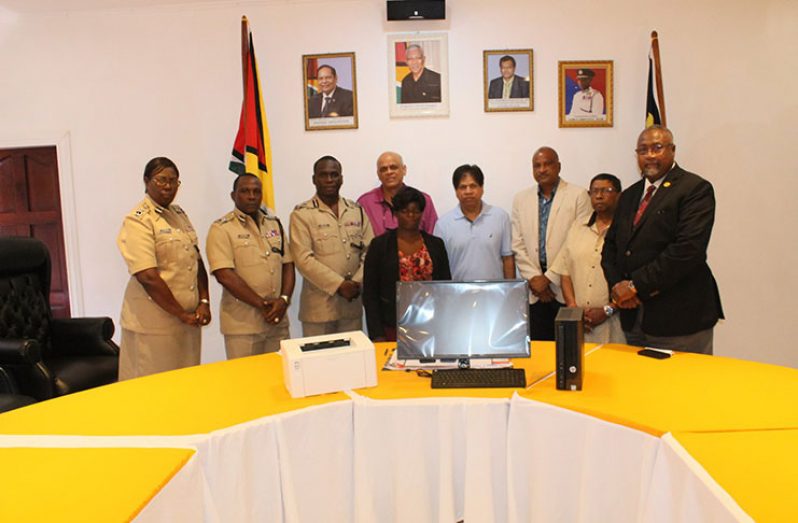 Commissioner of Police Leslie James (third from left) and Senior Vice President of Zara Realty, Jay Sobhraj with former top cop Seelall Persaud (third from right) and other officials at the handing-over ceremony