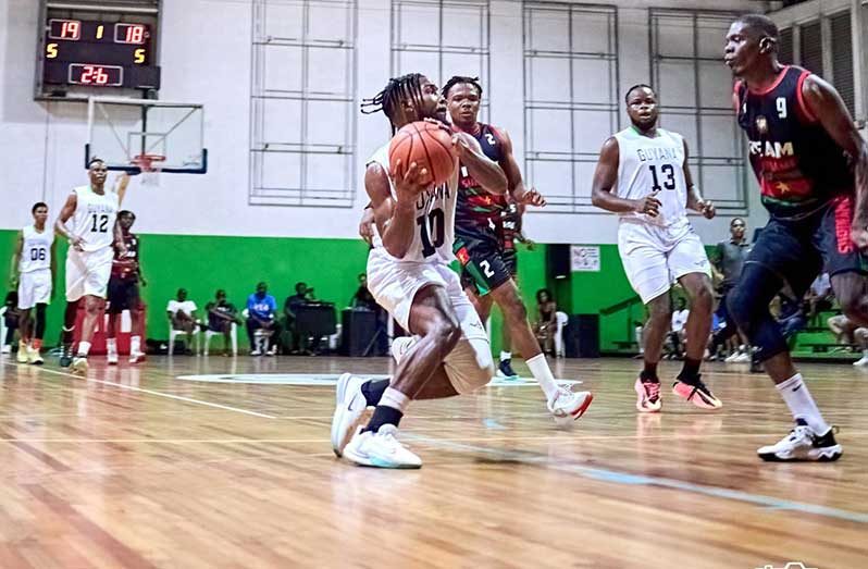 Point guard, Zian Gray in action for Guyana during the tri-nation series in Suriname